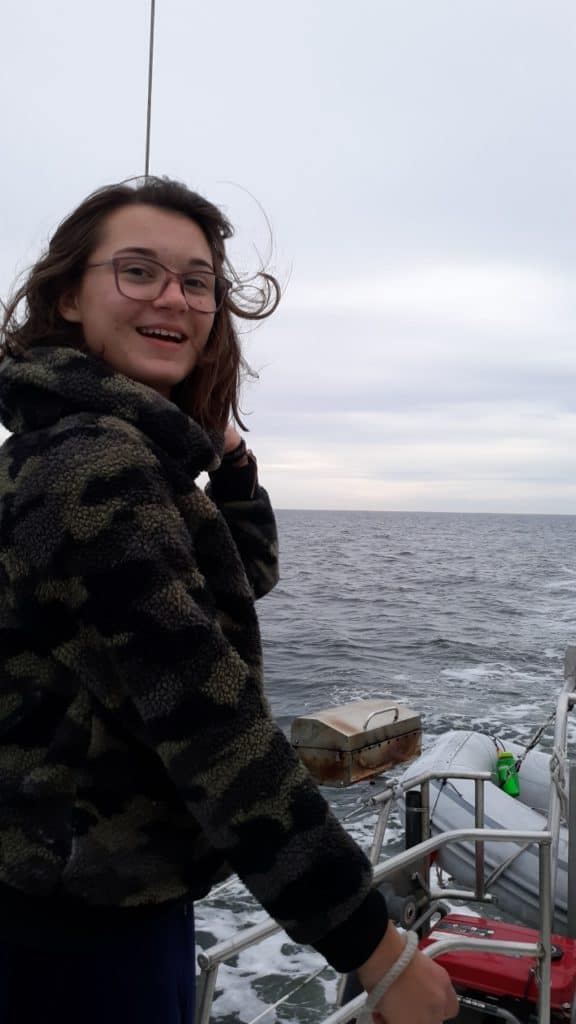 A girl smiling during a sailing trip