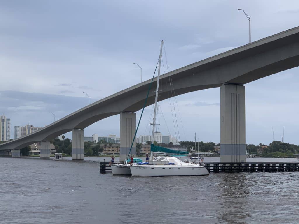 a catamaran going under a bridge on the ICW