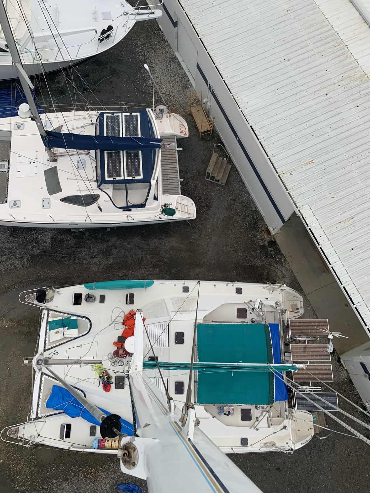 a view onto a catamaran from the top of its mast