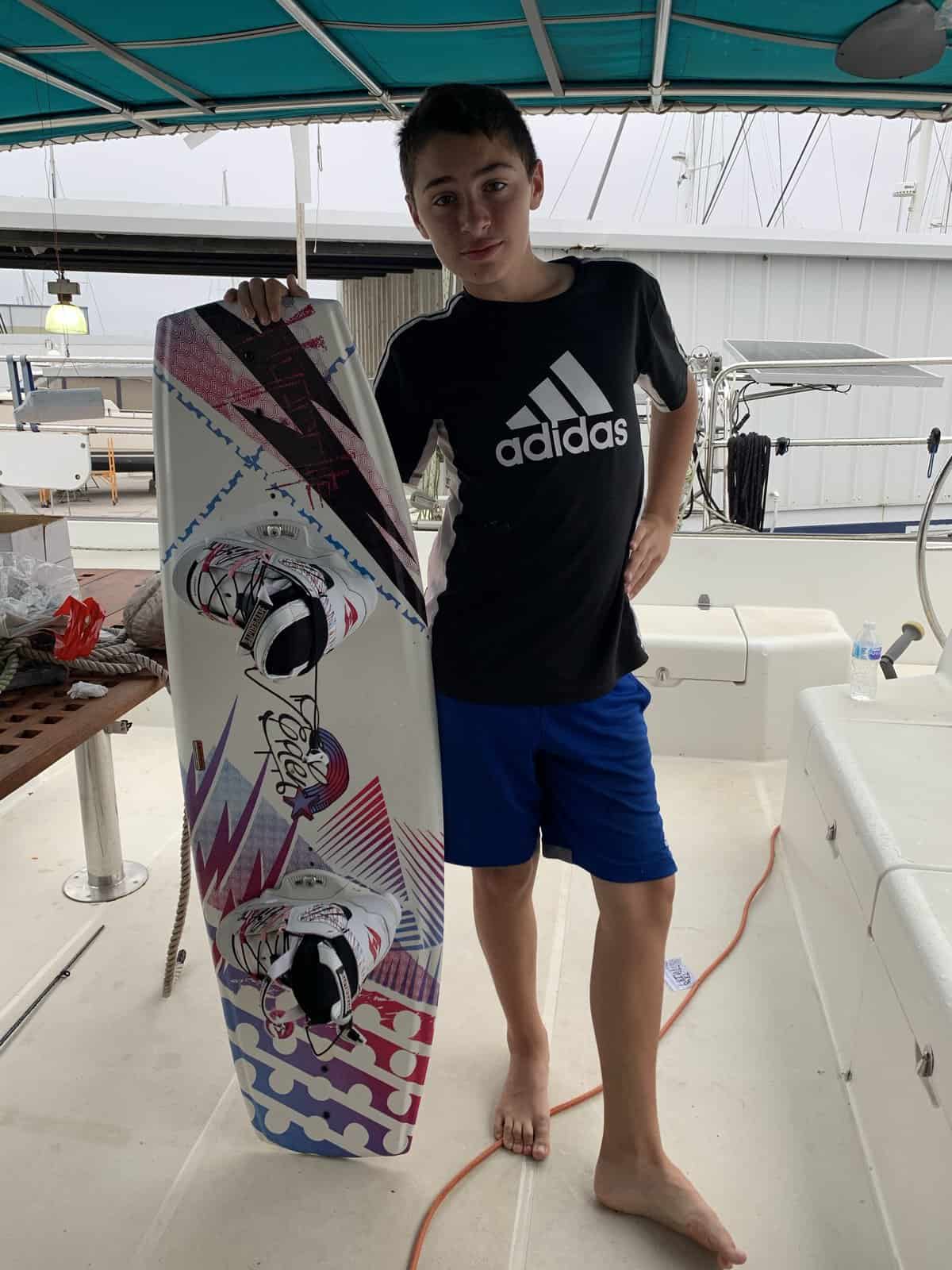 a boy with a wakeboard