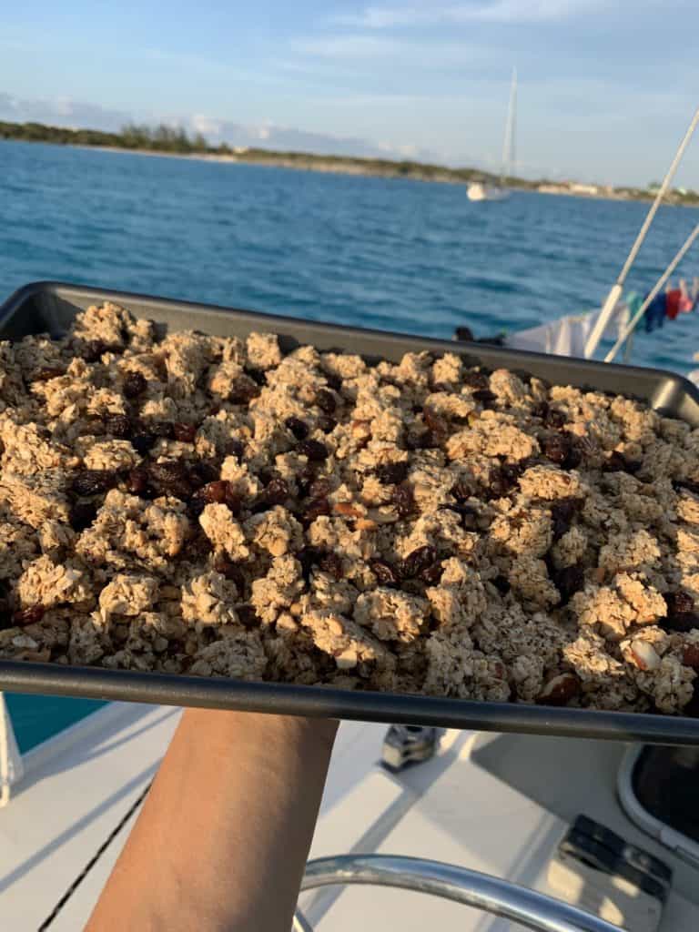 a pan of baked granola aboard a sailboat
