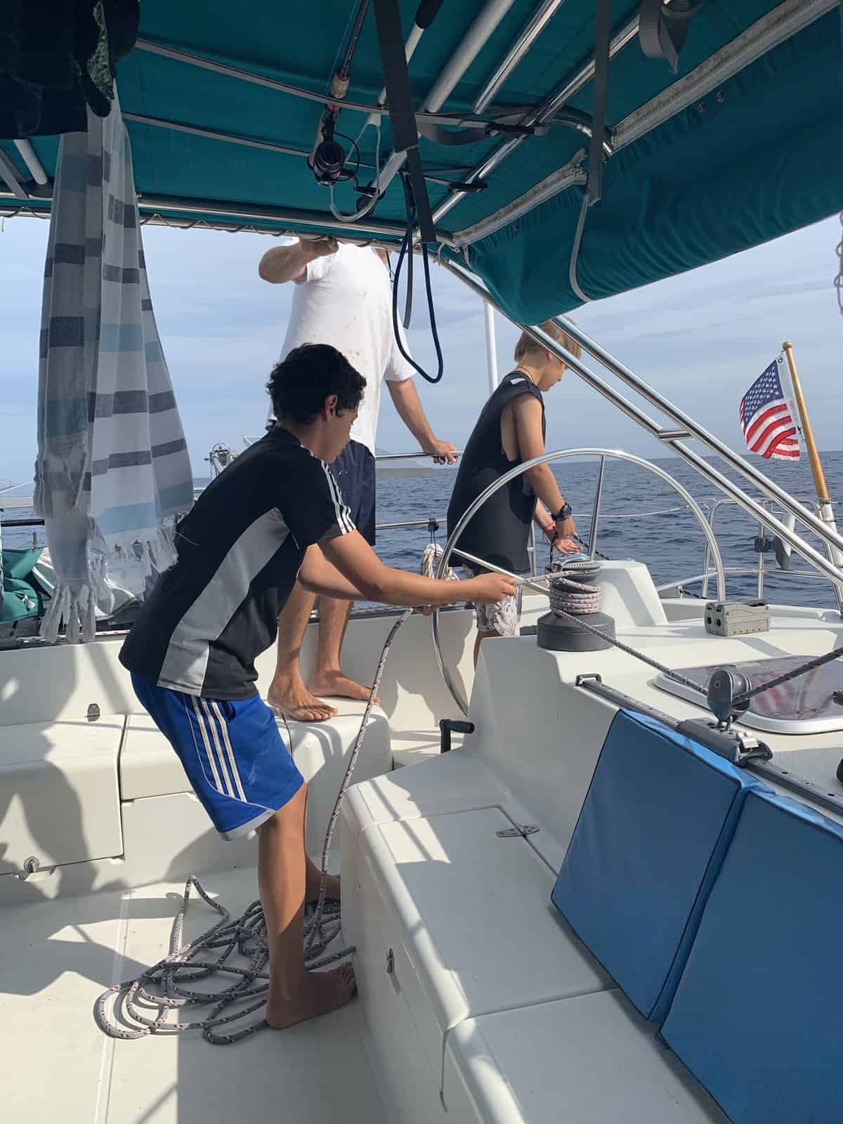 kids helping with the sails