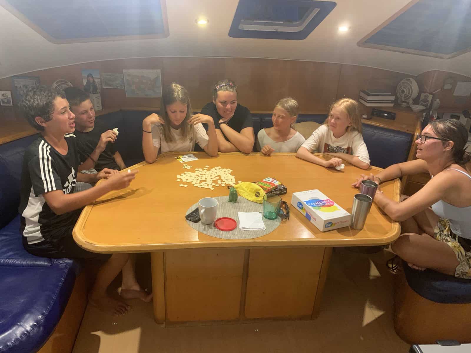 kids playing board games on a boat