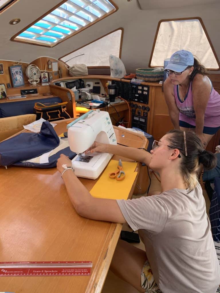 Sophie having a sewing class with a neighbor. Socializing the kids on the water requires communication with adults, frequently.