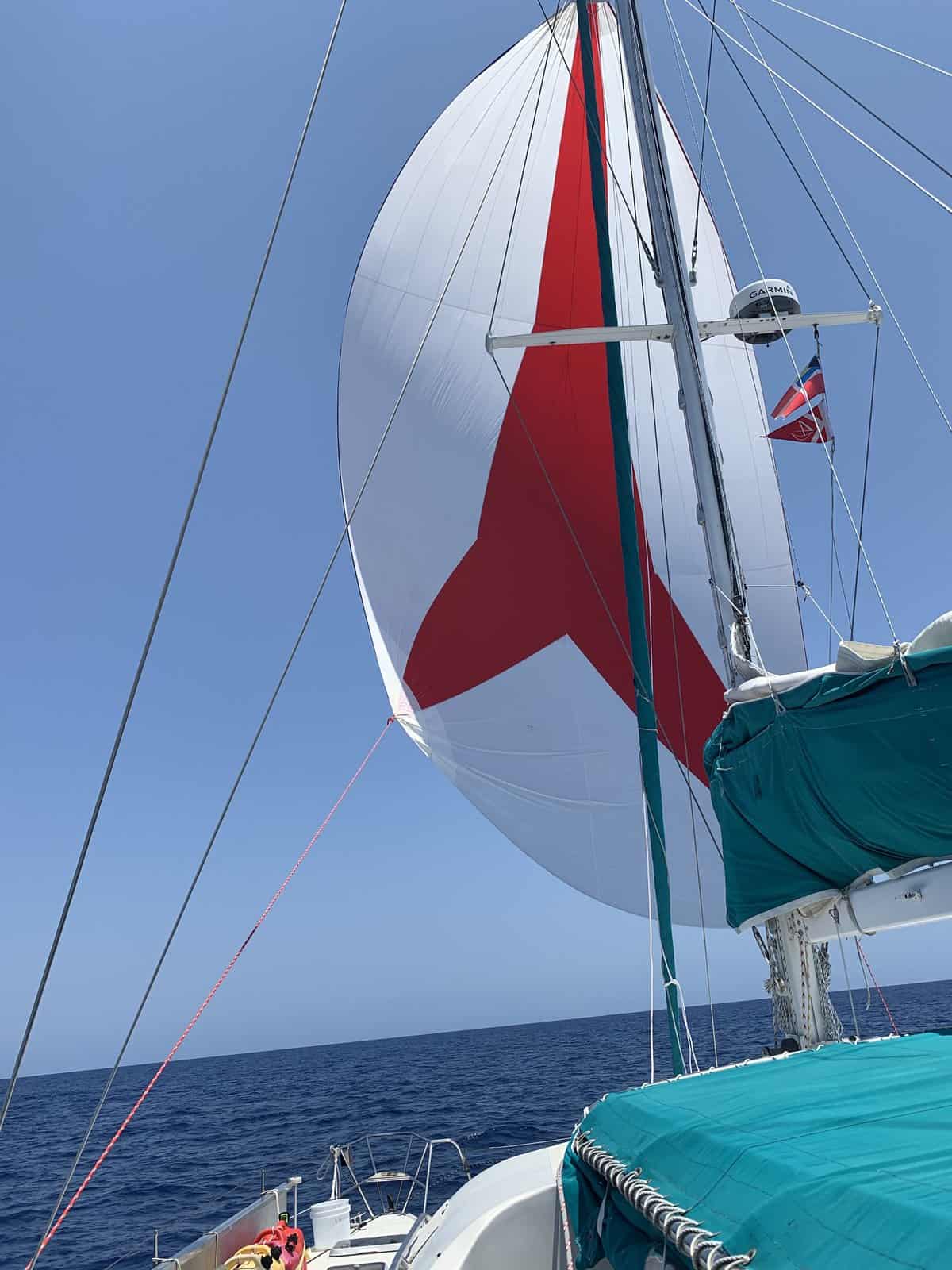 a spinnaker sail on a catamaran