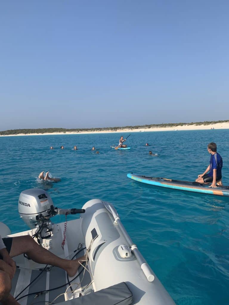 Kids swimming at Conception Island, Bahamas. 