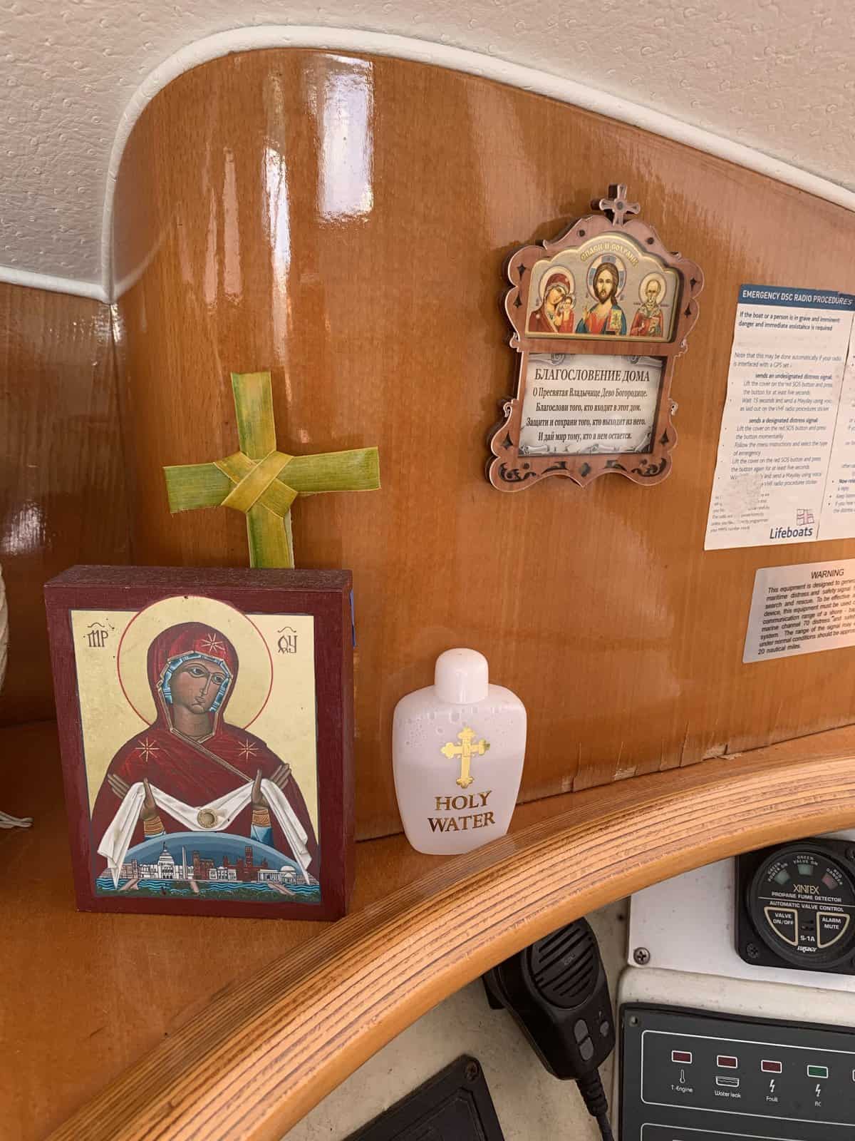 icon corner on a boat, with holy water bottle