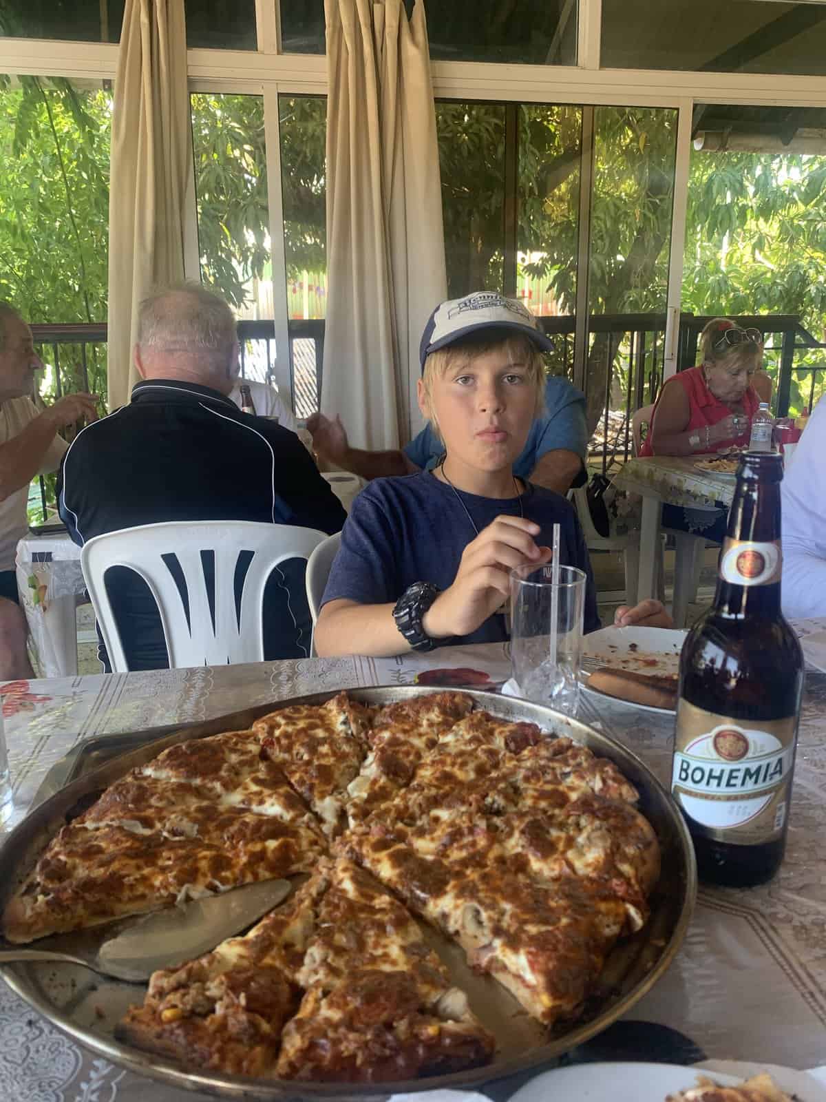 large pizza and a local beer, to celebrate Pascha in the Dominican Republic. 