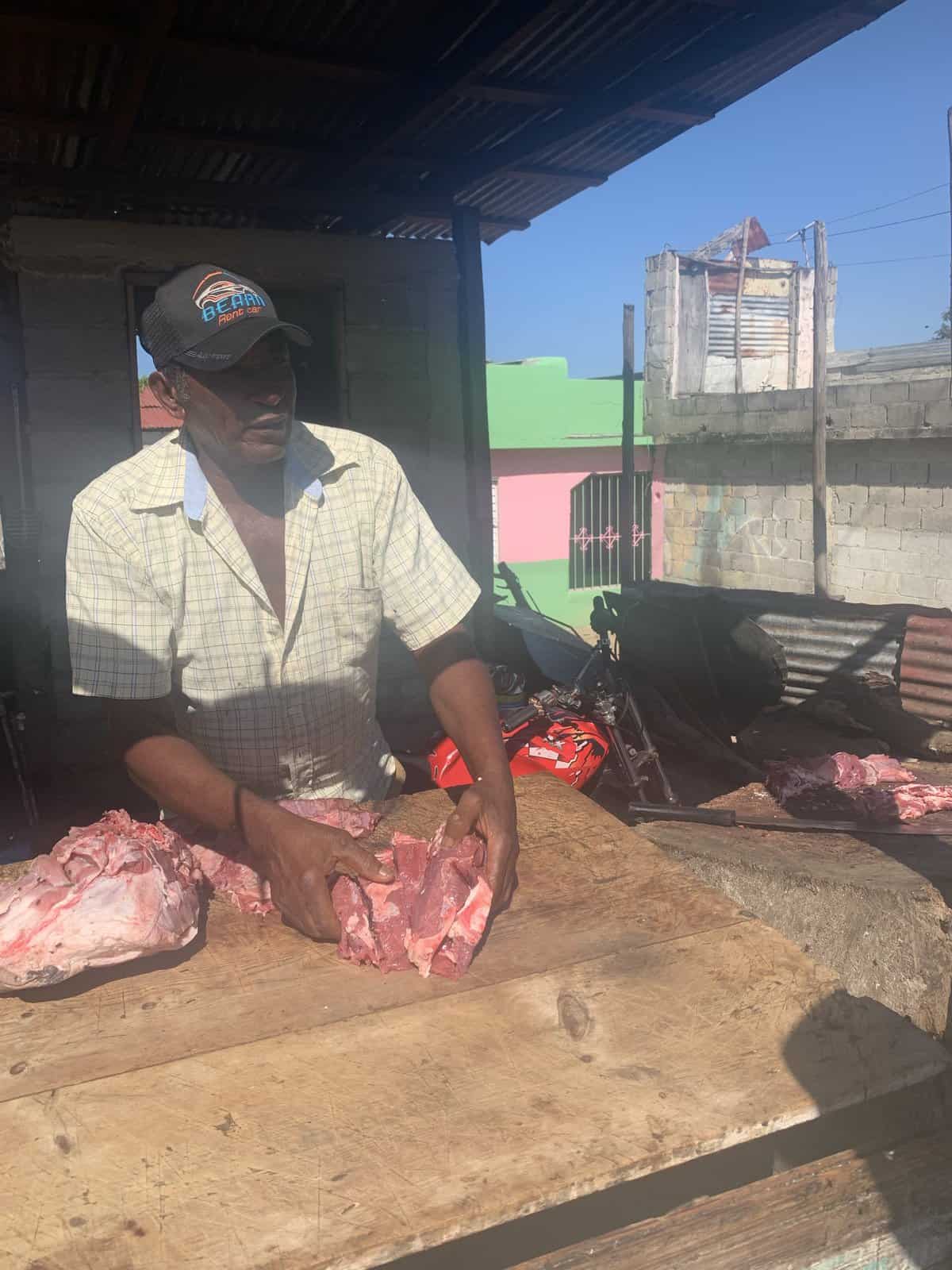 a local butcher on the street with raw beef