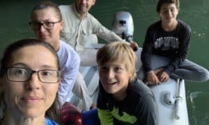 a family in a dinghy