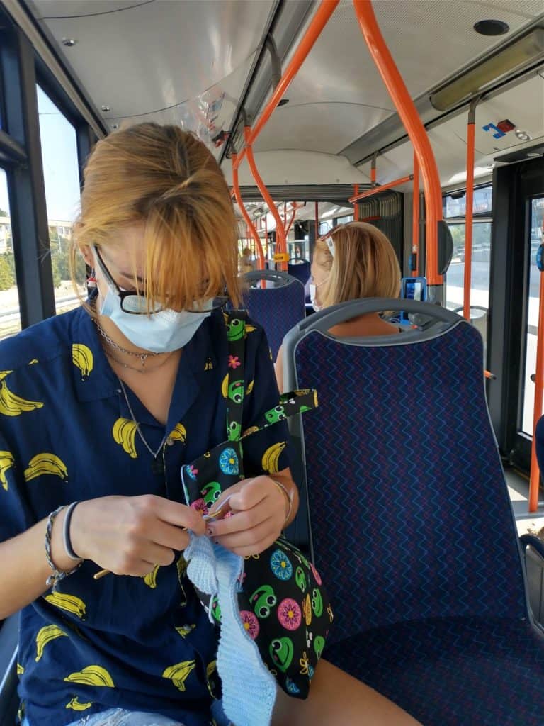 a girl riding a public transit bus