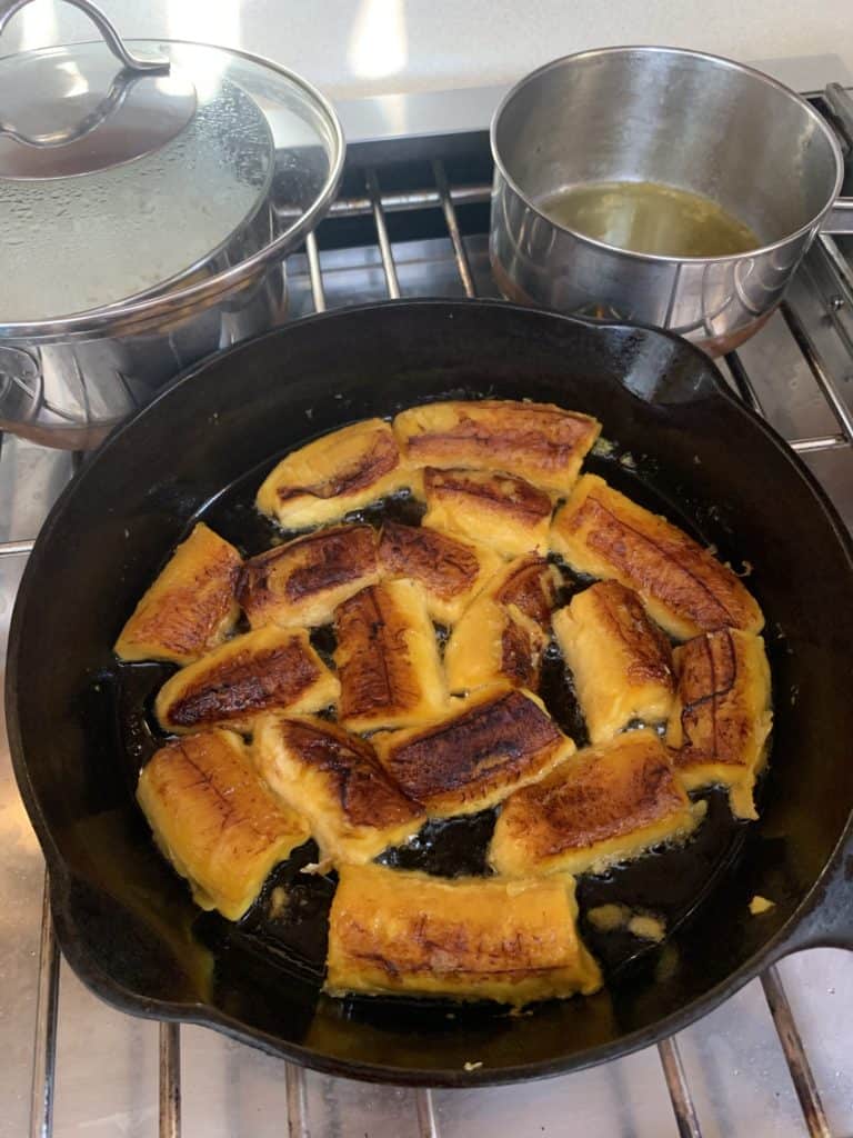 cast iron pan with plantains inside
