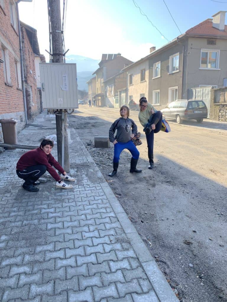kids wearing work boots on a street in Dobrinishte