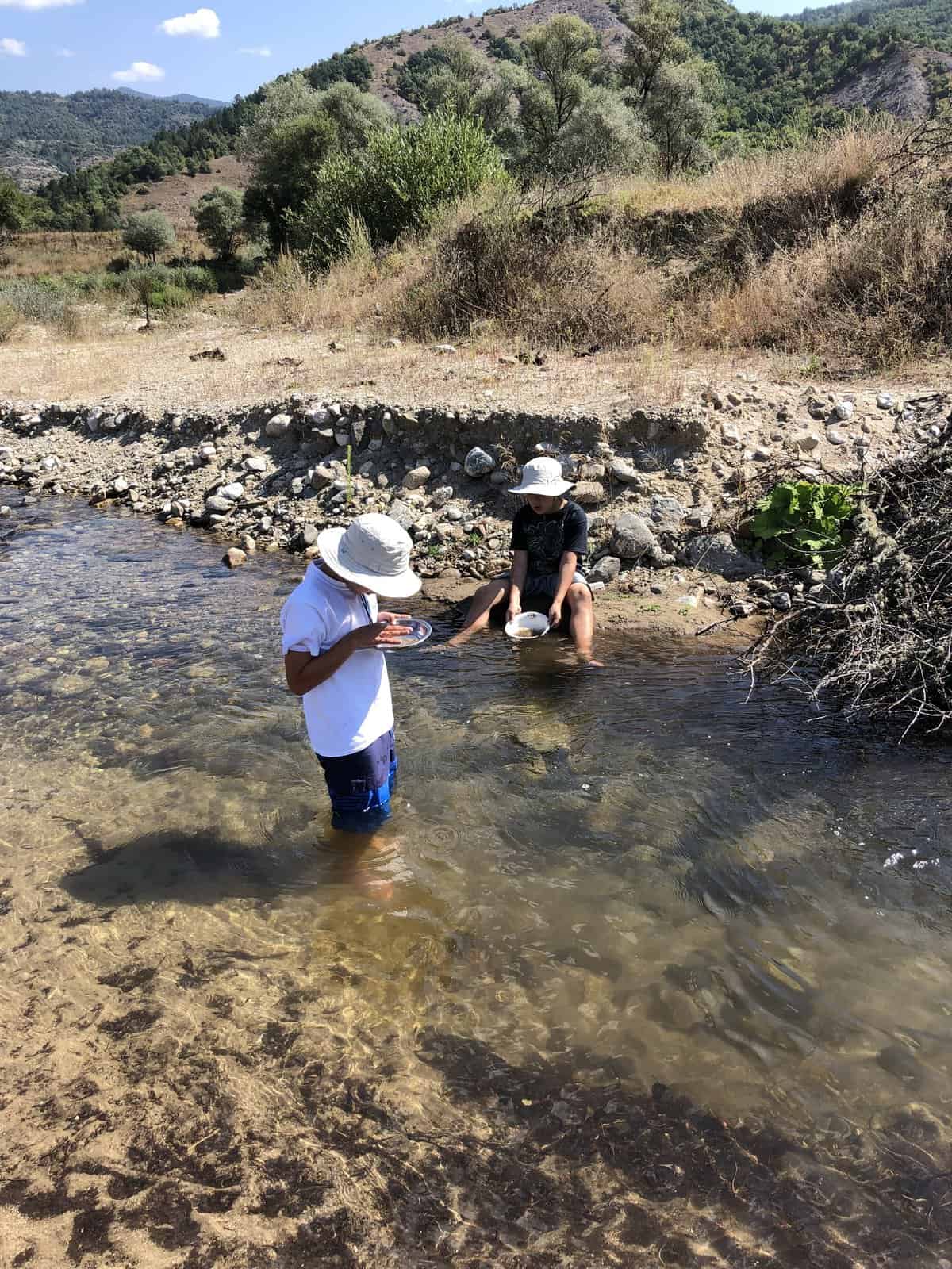 Panning for gold in a small river, in Bulgaria