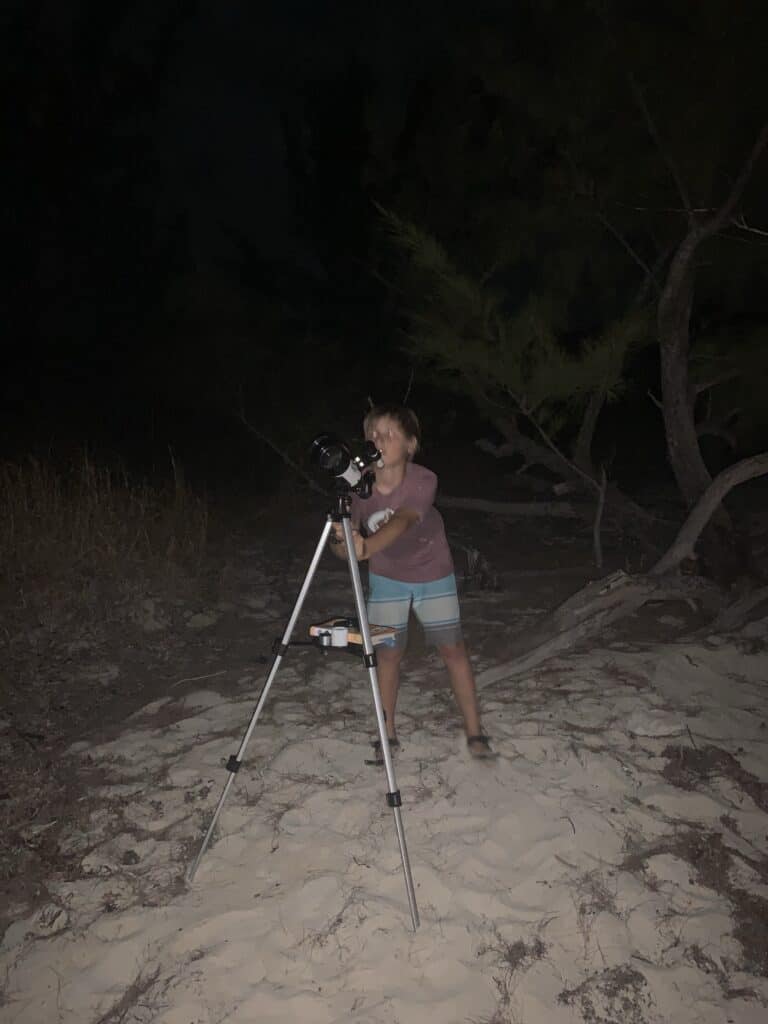 Out telescope set up on a sandy beach