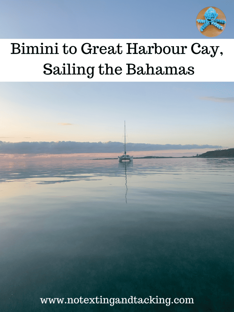 pinterest pin - a boat anchored at great harbour cay