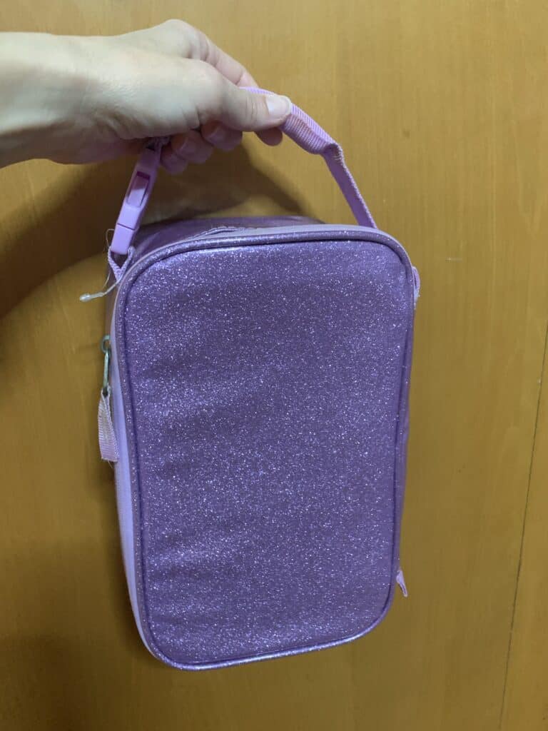 a sparkling purple lunch box to organize refrigerated food on a boat

