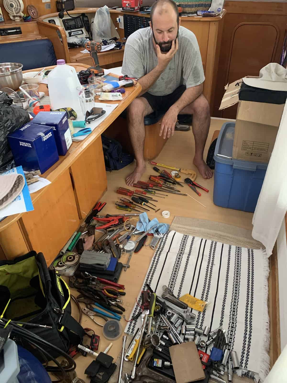 Joe wondering which tools to take and which ones to leave behind, on land.
