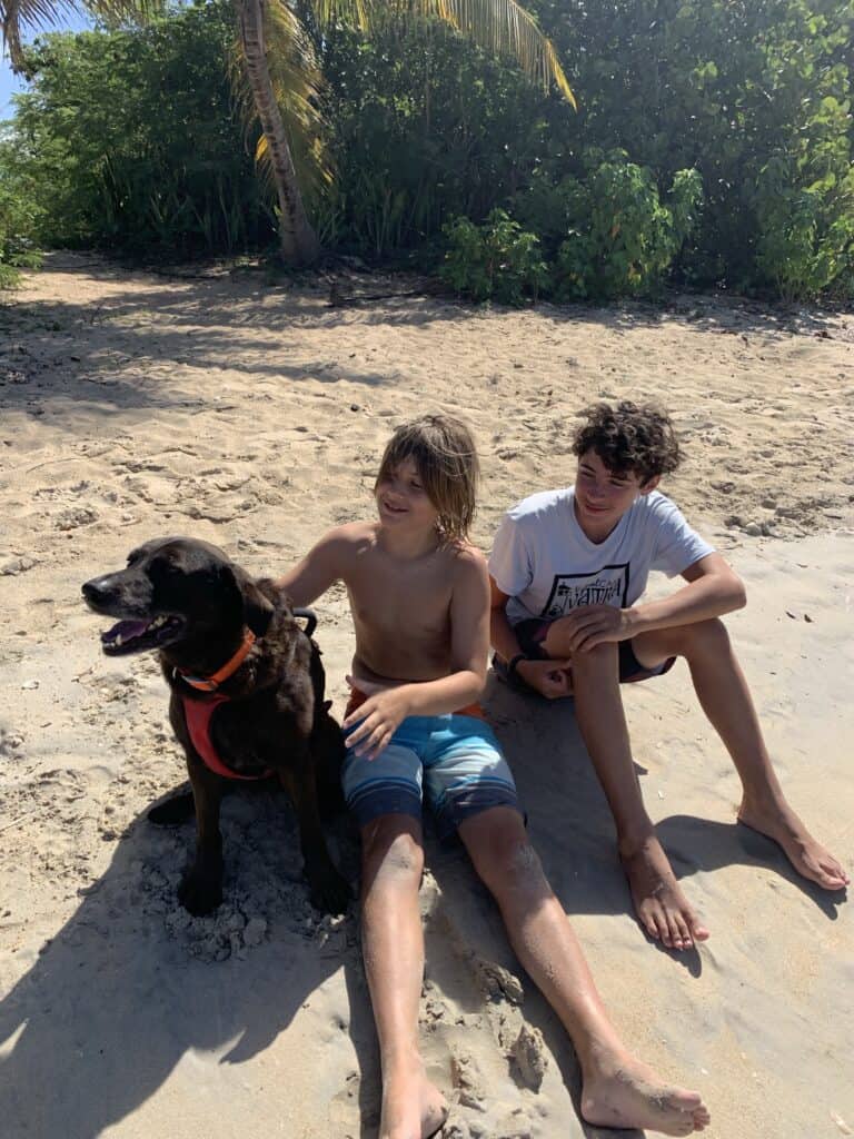 boys with a dog, on a beach, in Puerto Rico
