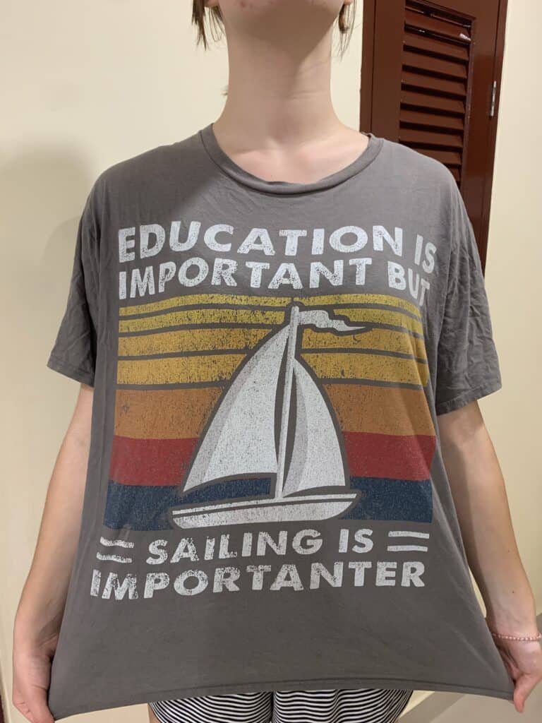 A T-shirt saying - Education is important, but sailing is importanter.