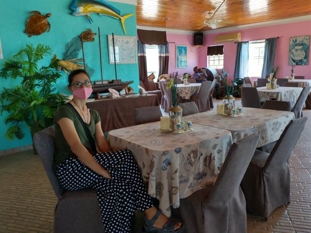 Inside a restaurant at Great Harbour Cay, walls decorated with colorful fish